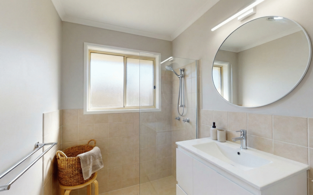 Budget-friendly bathroom renovation in Sydney, Australia completed under $10,000 with modern vanity, toilet, and cosmetic upgrades