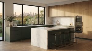 Modern open-concept kitchen with sage green base cabinets, natural wood uppers, and a marble waterfall island