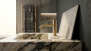 Modern marble bathroom vanity with brushed brass faucet and porcelain tile sample