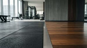 Modern gym interior featuring rubber flooring, timber flooring, and premium fitness equipment in a spacious workout area