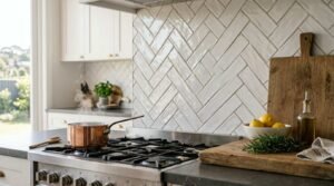 Modern Sydney kitchen featuring a white herringbone tile backsplash and premium gas cooktop.