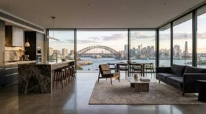 Modern renovated open-plan living space with panoramic Sydney Harbour views showcasing premium finishes that increase property value.