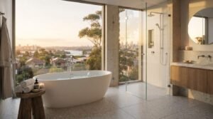 Luxury Sydney bathroom featuring a freestanding soaking tub overlooking harbour views, frameless glass walk-in shower, timber vanity, and large-format terrazzo floor tiles