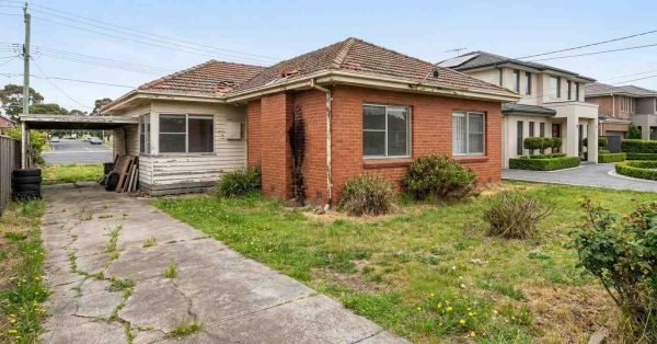 Australian suburban house with peeling paint cracked driveway overgrown yard and maintenance issues lowering property value