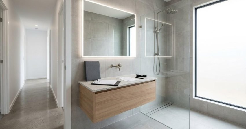Completed Australian bathroom renovation with inspection documents and premium finishes representing the defects liability period, final handover, and builder rectification obligations in NSW.