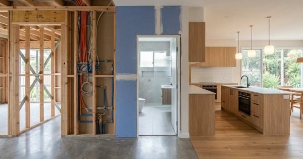 Modern Australian home renovation illustrating the correct trade sequence from framing and rough-in services to tiling, cabinetry, and completed interior finishes.