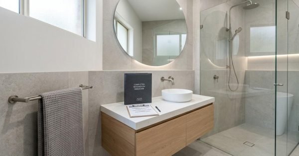 Modern Sydney investment property with a renovated kitchen, bathroom, and open-plan living area designed to improve rental appeal, tenant quality, and long-term property value.