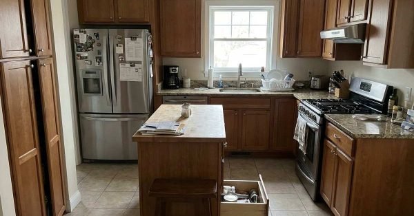 Kitchen with poor layout showing tight space blocked workflow and cabinet access issues