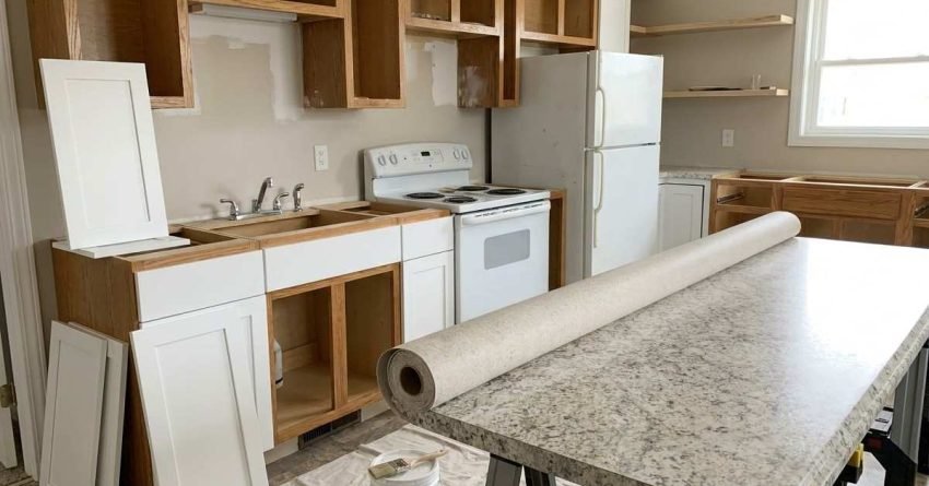 Small kitchen renovation with simple cabinets and laminate countertops showing budget-friendly upgrade