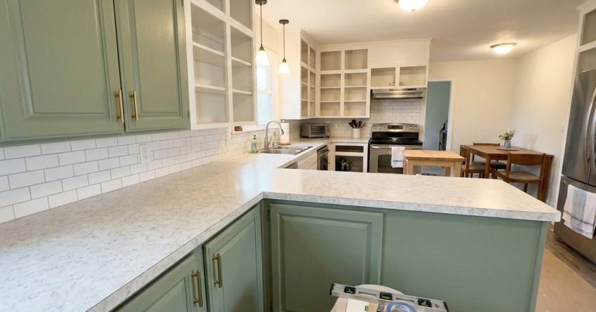 Kitchen with updated cabinet doors backsplash and countertops showing renovation within 10000 budget