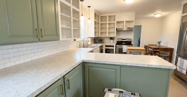 Kitchen with updated cabinet doors backsplash and countertops showing renovation within 10000 budget