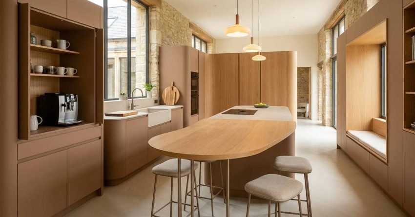 Modern kitchen with peninsula and freestanding worktable replacing traditional oversized kitchen island
