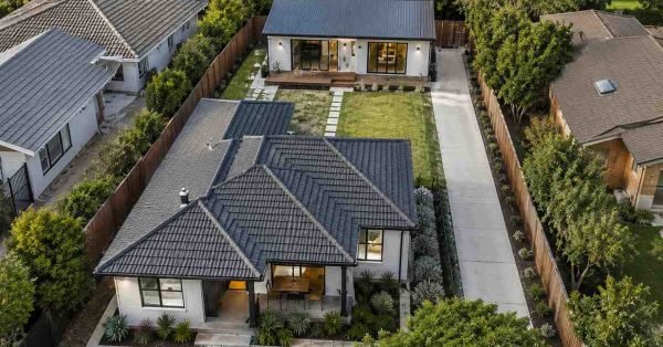 Aerial view of an Australian suburban property featuring a detached granny flat behind a primary residence, showing realistic lot layout, private access, landscaped surroundings, and efficient use of residential land.